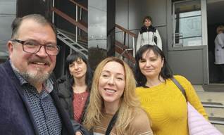 A group of people posing for a photo

Description automatically generated